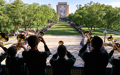 Notre Dame Band trumpets play a fanfare as the academic procession begins for the 2026 Commencement ceremony in Notre Dame Stadium.