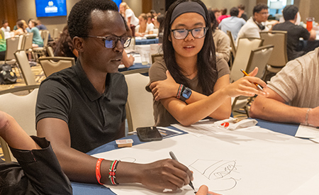 Students work together on an activity during the Notre Dame Innovation Challenge kickoff.