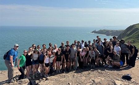 Engineering students pose for a group photo along the coast in Dublin.