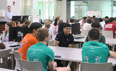 First-year engineering students attend a Welcome Weekend session in a classroom.