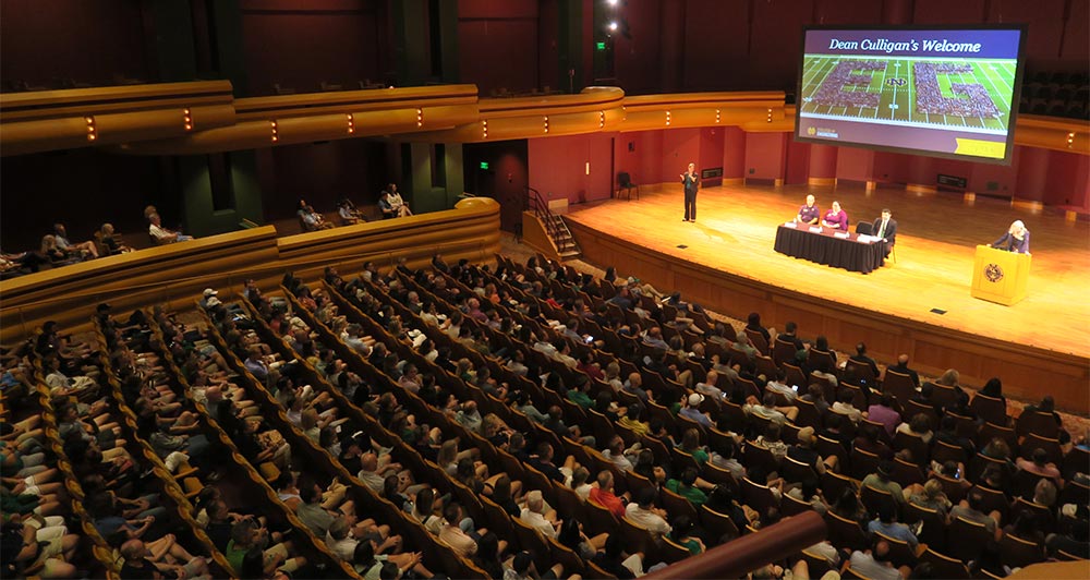 First-year engineering students attend a College of Engineering welcome event in an auditorium.