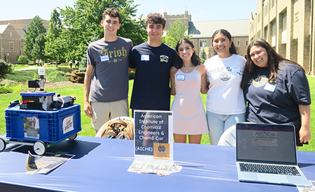 First-year engineering students learn about student organizations at an outdoor information fair.